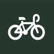 a white bike icon on a green background