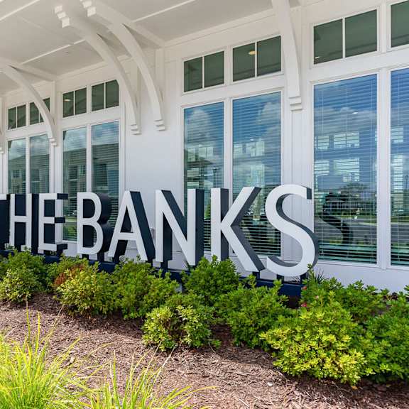 A sign that says "The Banks" in front of a building.