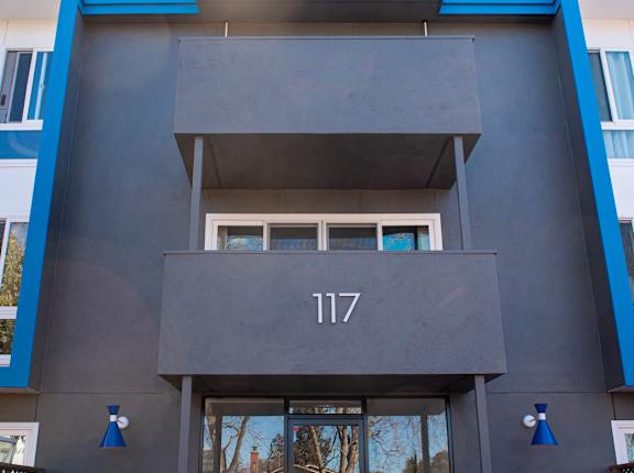 A modern building with the number 117 on the front.