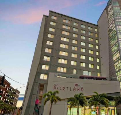 The Portland hotel is a large building with a modern design.