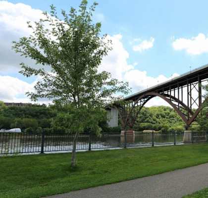 A Bridge Spans Over a River at Joseph's Pointe at Upper Landing Apartments, Minnesota, 55102