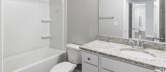 a bathroom with a toilet sink and bathtub