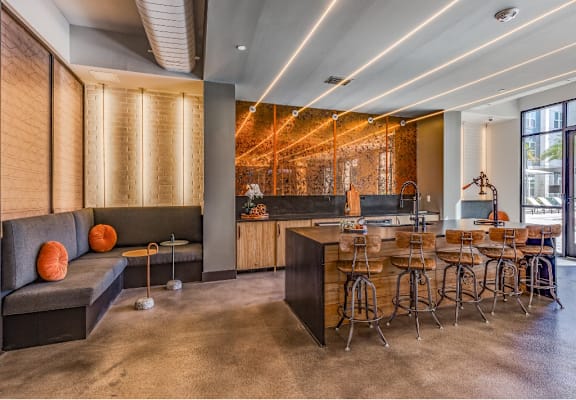 the lobby of a restaurant with a bar and tables at The Overlook in Winter Garden, FL