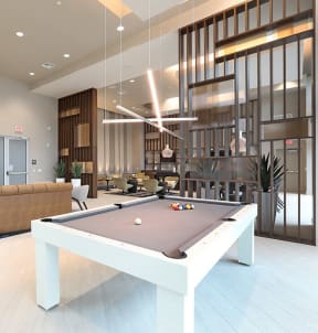 a living room with a pool table and a couch