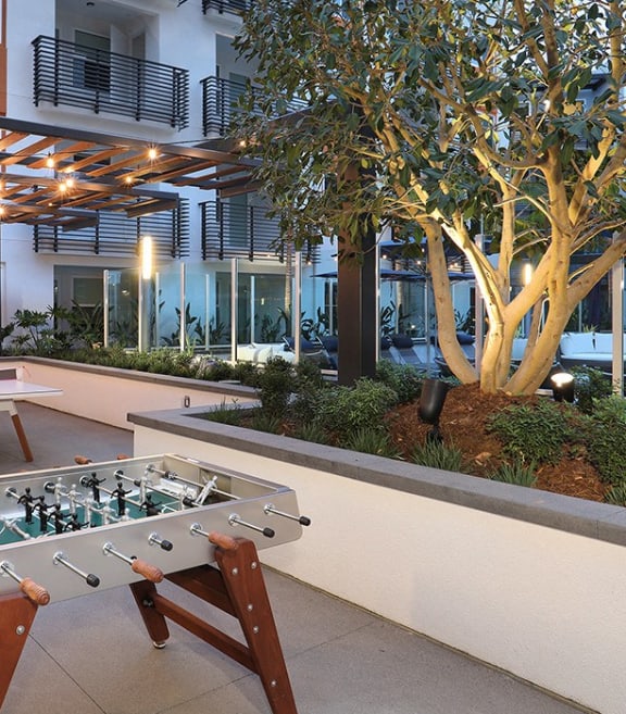 a foosball table in the courtyard of an office building