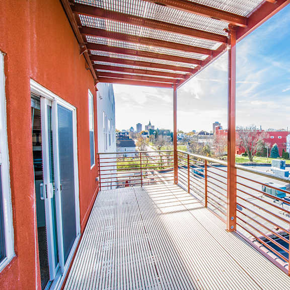 A view of the city from the balcony of an apartment at Latitude Apartment Homes.