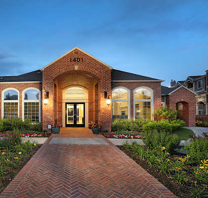 A house with a brick facade and a large front door.