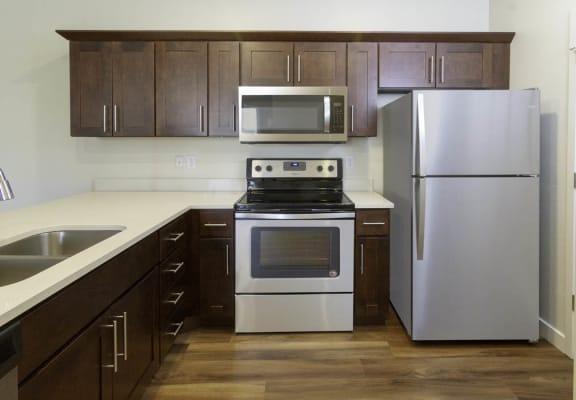 upgraded kitchen with stainless steel appliances at Four Seasons Apartments & Townhomes, North Logan