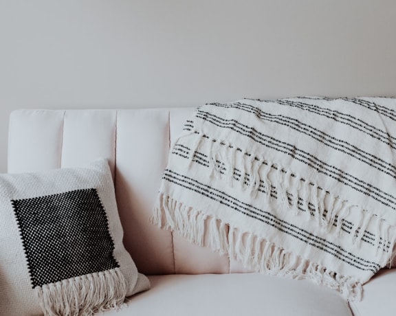 Stock image of white sofa with pillow