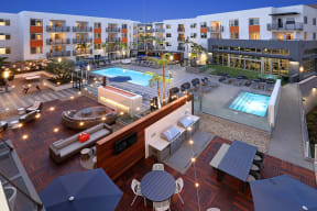 Resort-style pool with surrounding apartment buildings at Eleven 10 in Orange, CA