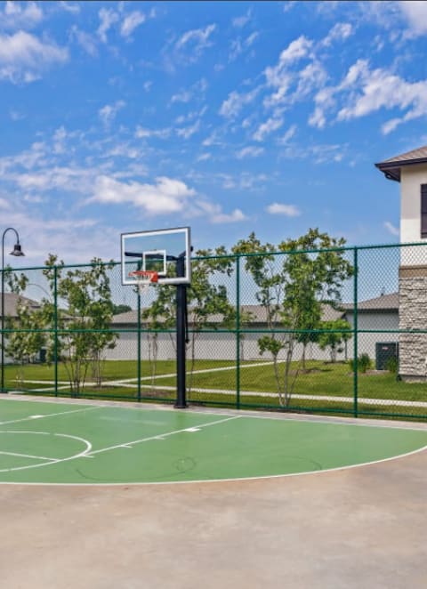 the basketball court at the estates apartments at Cypress Creek at River Oaks, Waxahachie