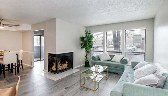 A living room with a fireplace and a couch.