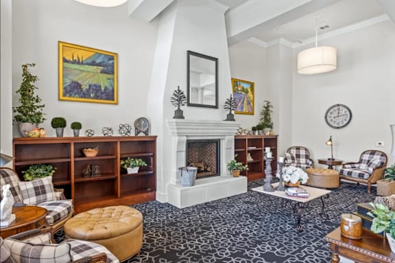 a living room filled with furniture and a fireplace at Cypress Creek at River Oaks, Texas