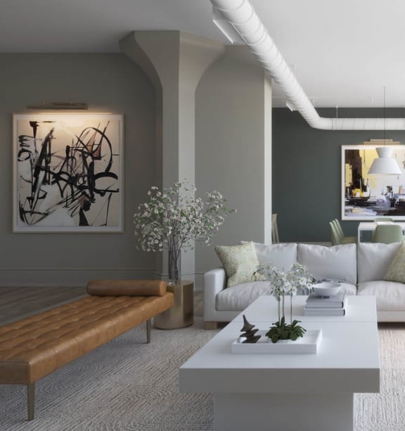 a living room with a white couch and a table at East 4th Street, Cleveland, 44115