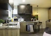 Thumbnail 6 of 8 - a kitchen with a sink and a counter top