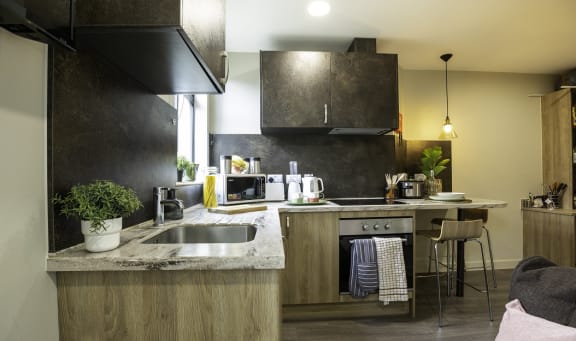 a kitchen with a sink and a counter top