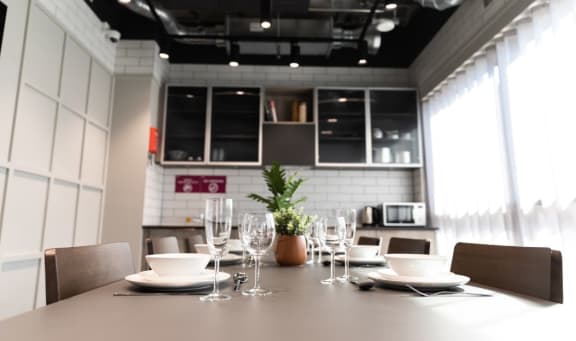 a dining room with a table and chairs