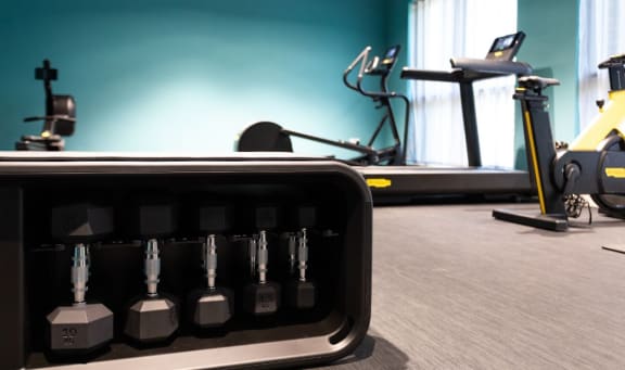 a room filled with lots of different types of exercise equipment