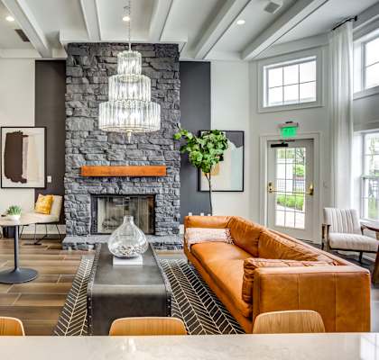 a living room with couches and a fireplace
