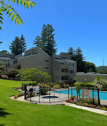 A large house with a pool in the backyard.