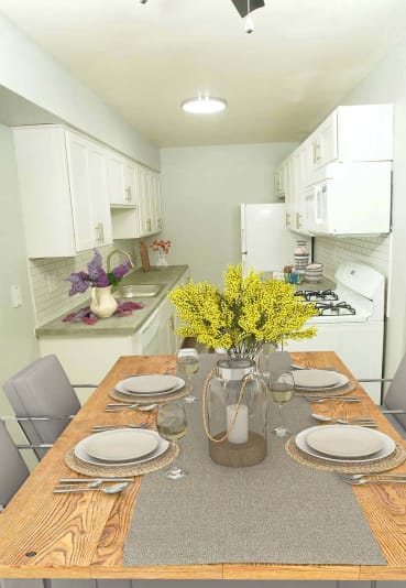 a kitchen and dining room with a table and chairs