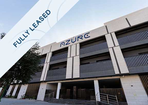 A modern building with the word "nzurc" on the top.