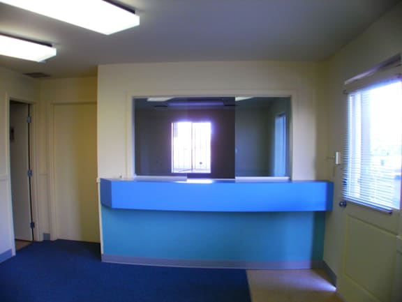 a bar in a room with a blue counter