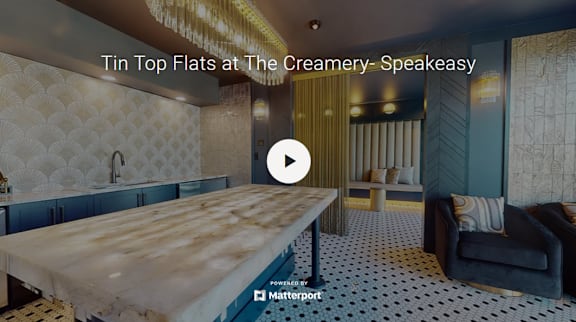 A video thumbnail showing a room with a wooden table and a sofa.
