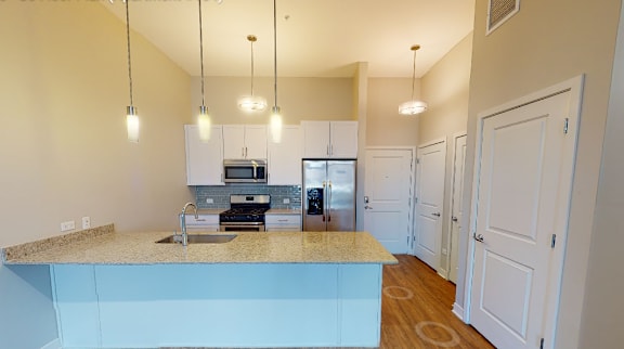 A kitchen with a counter and cabinets.