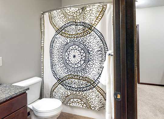 This full bathroom with tub/shower combo is available in the Cedar floor plan at the Villas at Wilderness Ridge