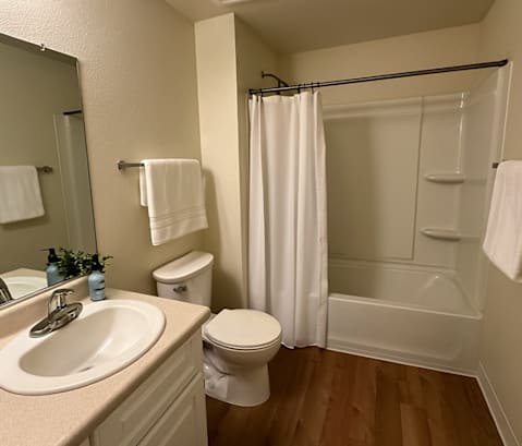 A bathroom with a toilet, sink, and shower.at Emerald Pointe, Rohnert Park, CA 94928