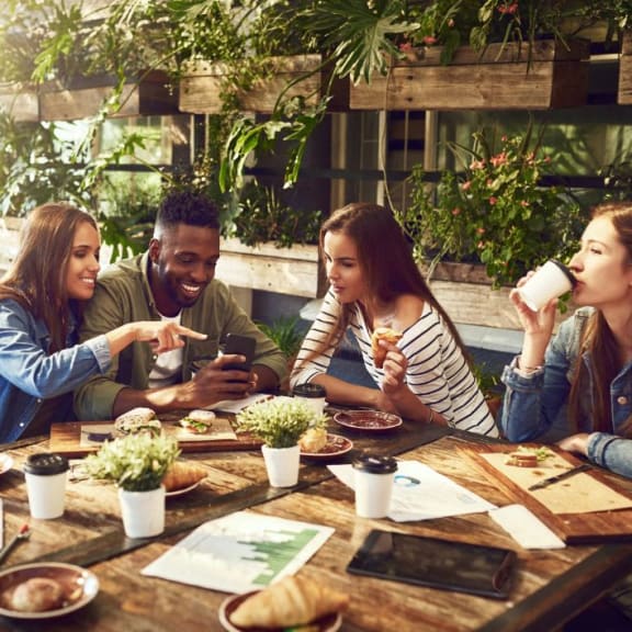 a group of people sitting around a table