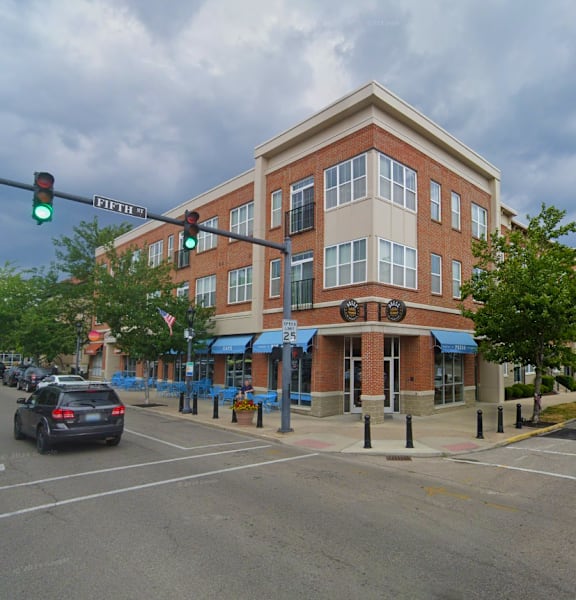 a building on the corner of an intersection with a traffic light at Monmouth Row Apartments, Newport, 41071
