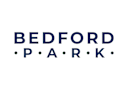 The image shows the word "BEDFORD" in large letters with a dark background and a pattern of dots.
