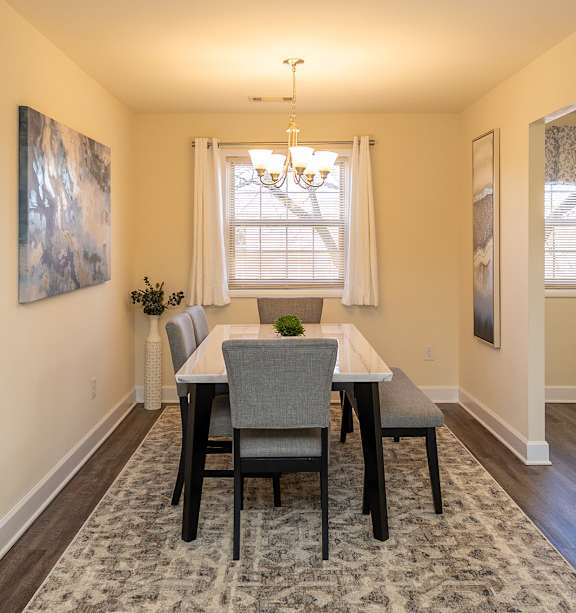 a bedroom with a bed and two night stands at Liberty Gardens Apartments, Maryland, 21244