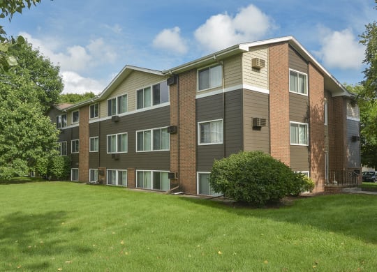 Mature Trees and Landscaping In Front of an Apartment Building at Timberland at Crestbruck