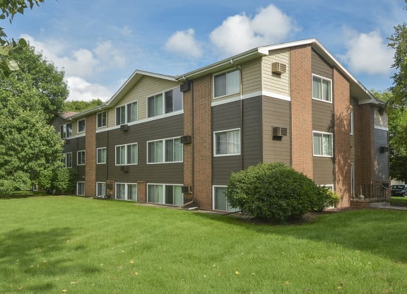 Mature Trees and Landscaping In Front of an Apartment Building at Timberland at Crestbruck