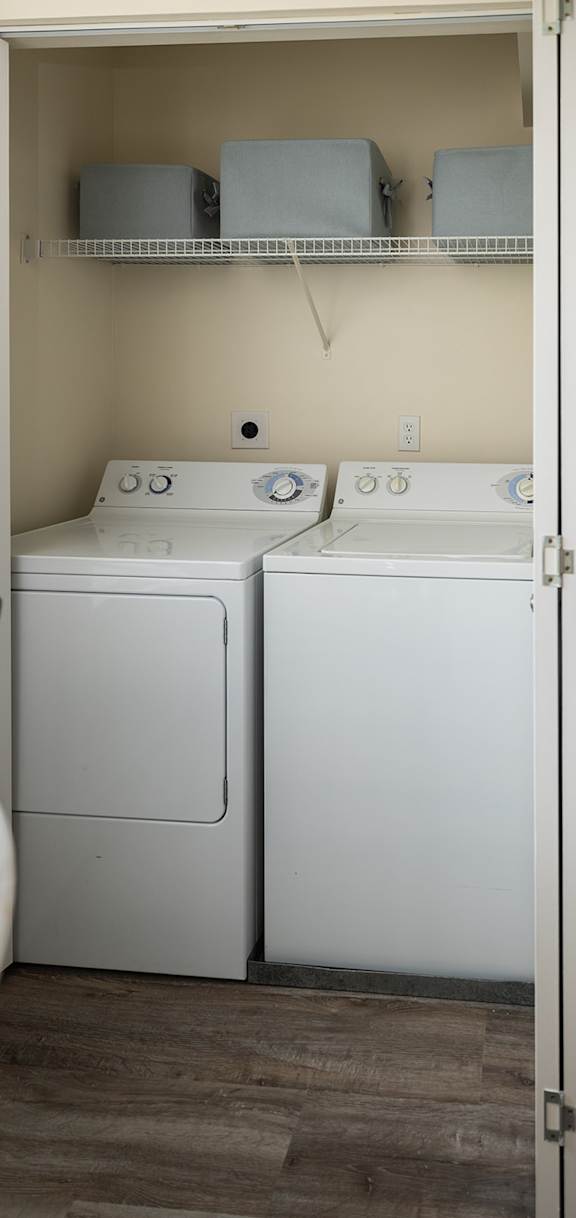 a kitchen with a stove and a sink and a refrigerator at The Summit at Owings Mills Apartments, Owings Mills, MD 21117