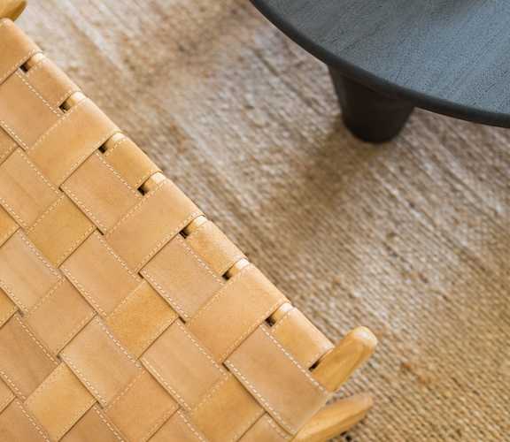 a table and two chairs with a hat on top of them
