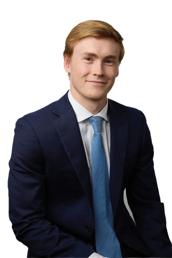 a young man in a suit and tie