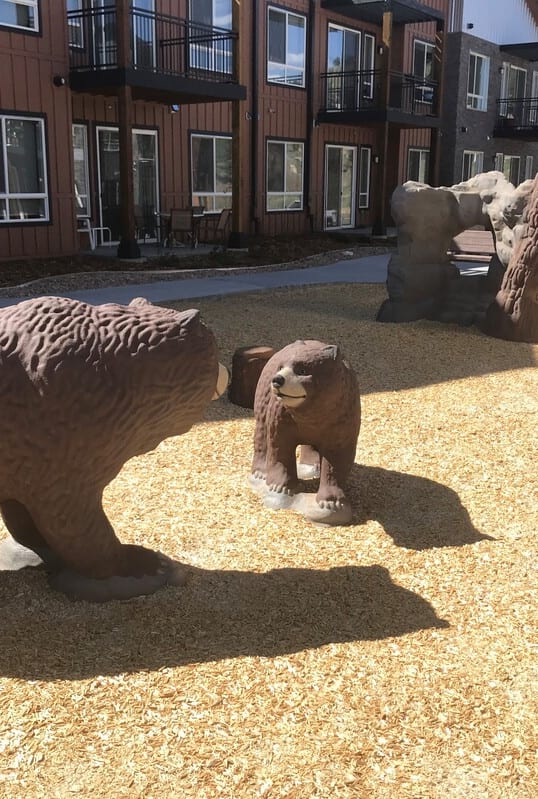 three bears statues in front of a building