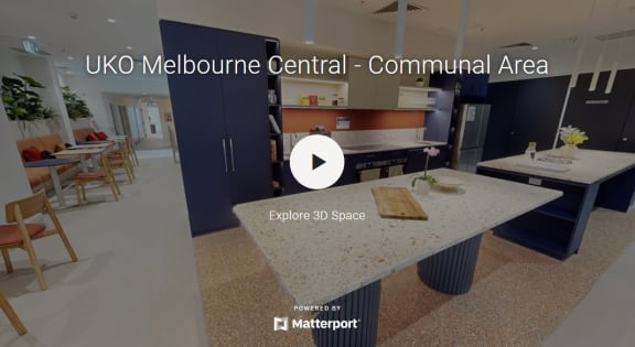 a view of the uko central communal area with a kitchen and tables