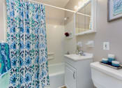 Thumbnail 7 of 12 - A small white bathroom with a white sink and a white toilet at Rose Hill Estates, Norwich, CT, 06360