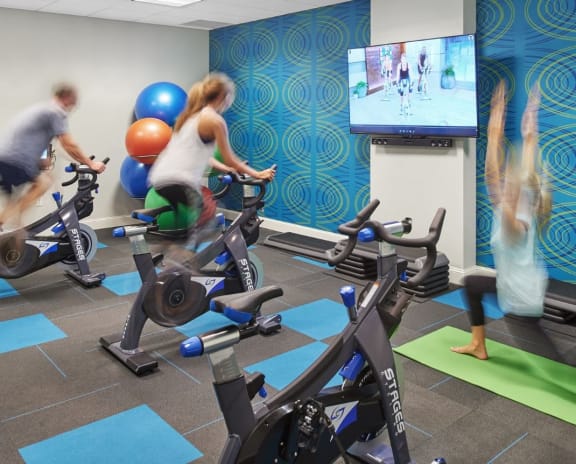 a group of people working out in a gym on exercise bikes at Metro67, Memphis