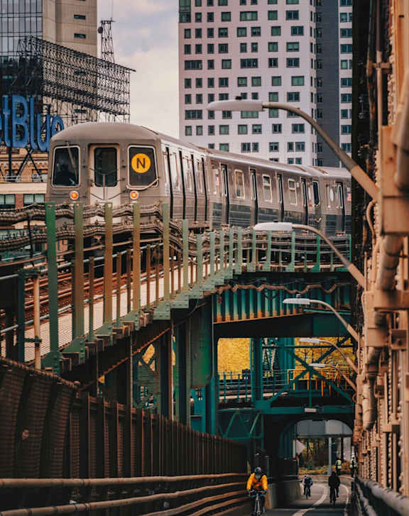 A train with the letter N on the front is on a track.