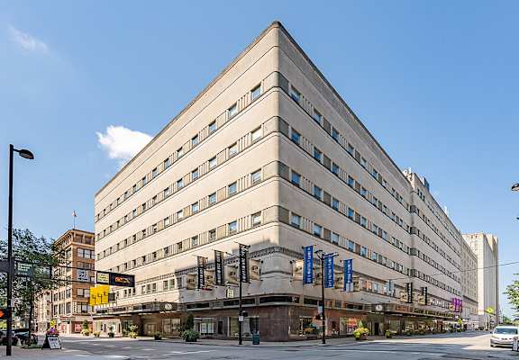 a large building on the corner of a city street at The Lofts at Shillito Place, Ohio
