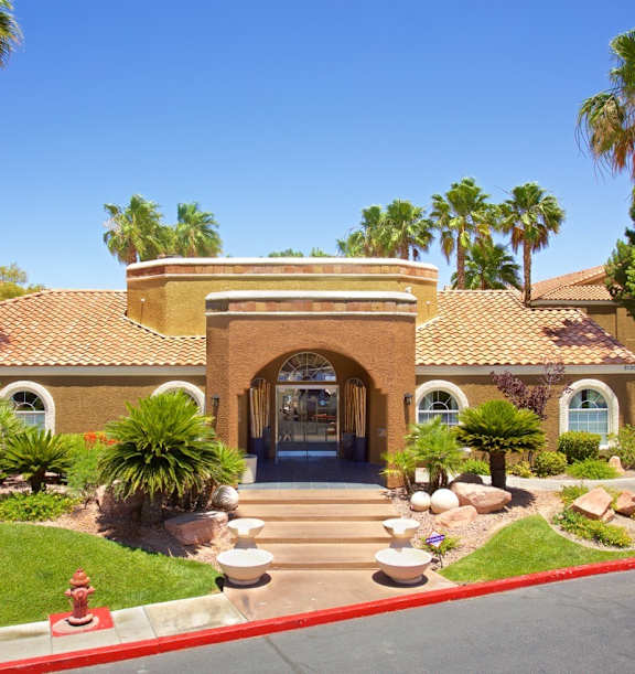 a house with palm trees in front of it