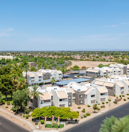 an aerial view of a neighborhood with houses and a highway