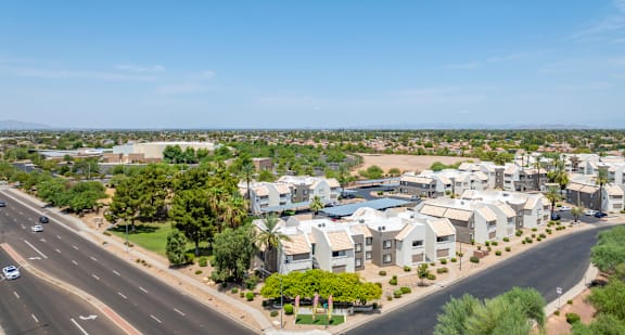 an aerial view of a neighborhood with houses and a highway