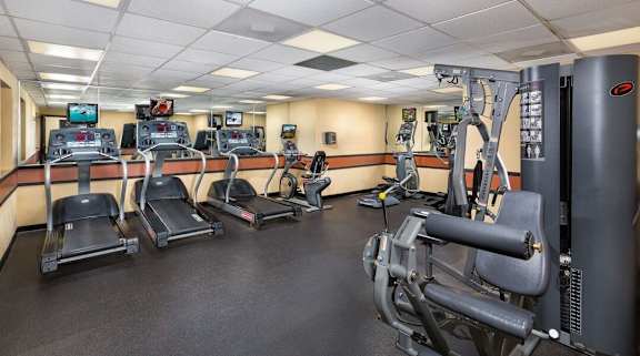 A gym with treadmills, exercise bikes, and other equipment. at Charlestowne North Apartments, Maryland